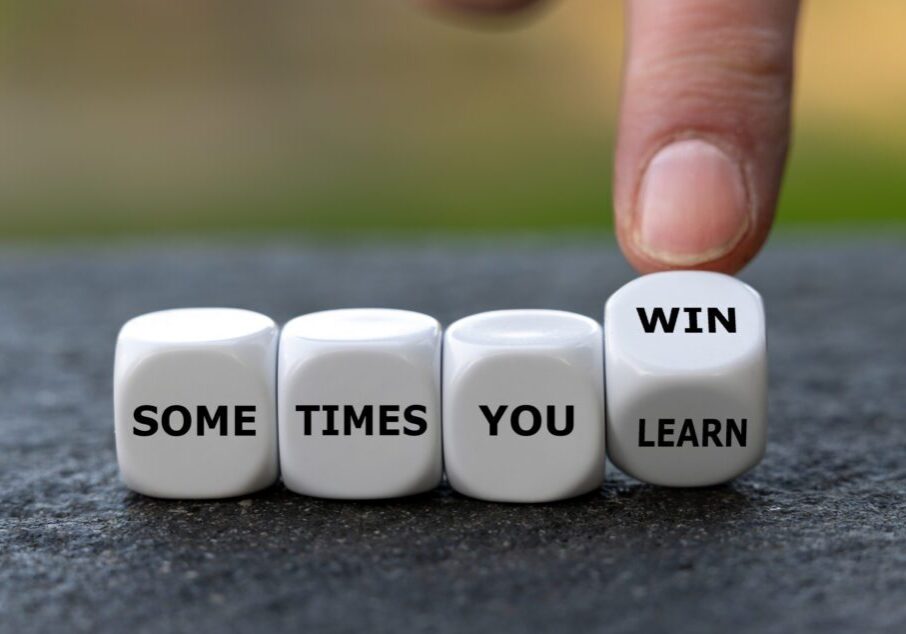 Dice form the expression 'sometimes you win' and 'sometimes you learn'.